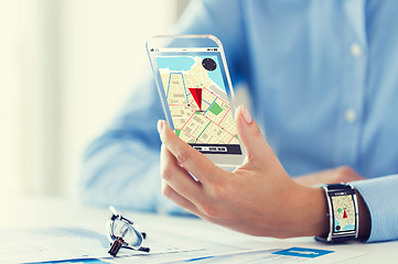 Image showing hand with navigator map on smart phone and watch