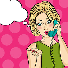 Image showing Surprised pop art  woman chatting on retro phone . Comic woman w