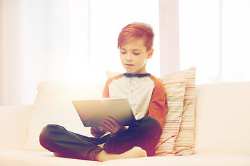 Image showing boy with tablet computer at home