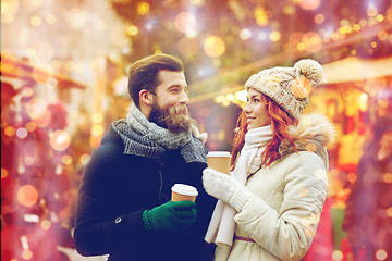 Image showing happy couple drinking coffee on old town street