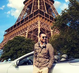 Image showing happy man near cabriolet car over eiffel tower
