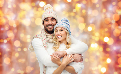 Image showing smiling couple in winter clothes hugging