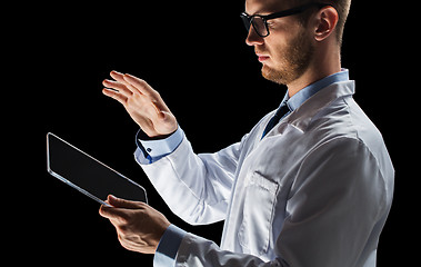 Image showing close up of doctor or scientist with tablet pc