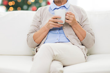Image showing close up of senior woman with tea cup at christmas