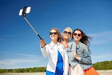 Image showing group of smiling women taking selfie on beach