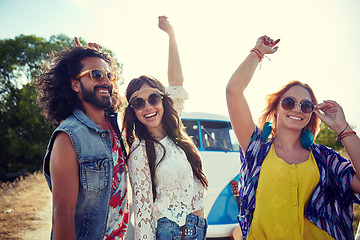 Image showing happy young hippie friends dancing outdoors