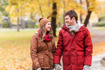 Image showing happy young couple walking in autumn park