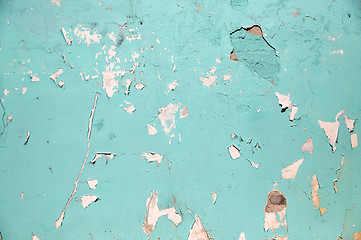 Image showing blue or turquoise wall with peeling paint surface