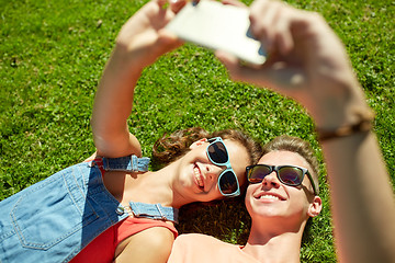 Image showing happy couple taking selfie on smartphone at summer