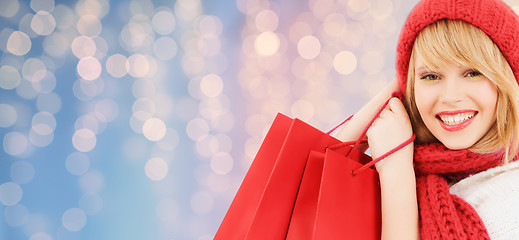 Image showing smiling young woman with shopping bags