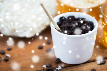 Image showing homemade coffee scrub in cup on wooden table