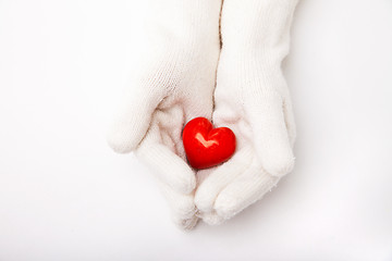 Image showing Woman hands in white gloves holding heart symbol