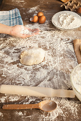 Image showing Baker is holing flour on his palm.