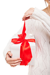 Image showing Woman with box of gift in hand on white isolated