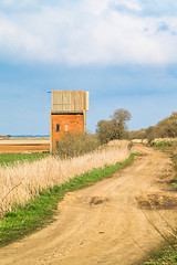 Image showing Small house by a countryside road