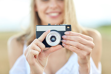 Image showing close up of woman photographing with film camera