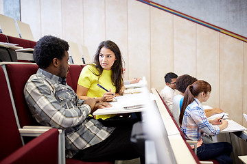 Image showing group of students with notebooks at lecture hall