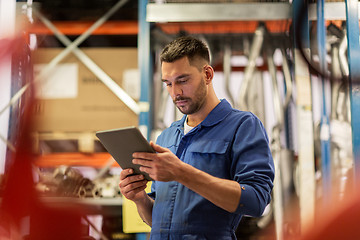 Image showing auto mechanic or smith with tablet pc at workshop