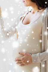 Image showing close up of happy pregnant woman with big belly