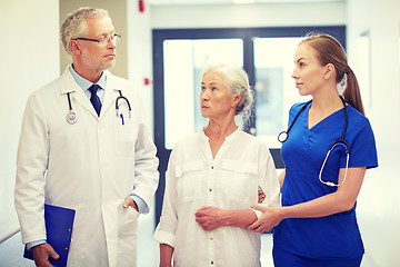 Image showing medics and senior patient woman at hospital