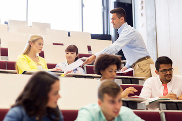 Image showing teacher giving test to students on lecture