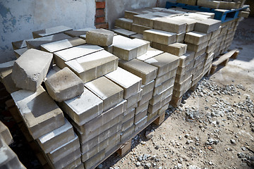 Image showing bricks batch on wooden storage pallet