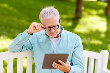 Image showing senior man with tablet pc at summer park