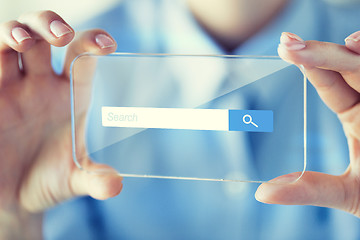 Image showing close up of woman with transparent smartphone