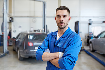 Image showing auto mechanic man or smith at car workshop