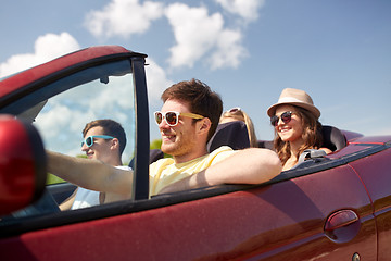 Image showing happy friends driving in cabriolet car