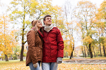 Image showing happy young couple walking in autumn park