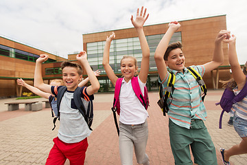 Image showing group of happy elementary school students running