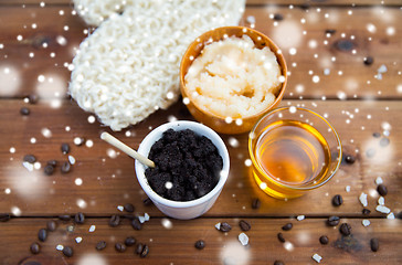 Image showing coffee scrub in cup with honey and wisp on wood