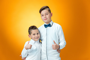 Image showing Happy children showing thumbs up sign OK