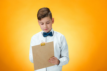 Image showing The boy with pen and tablet for notes