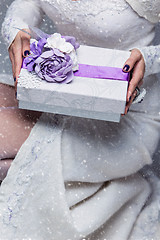 Image showing Bride holding present box