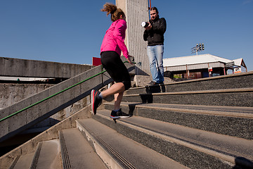 Image showing woman jogging on  steps