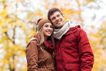 Image showing happy young couple walking in autumn park