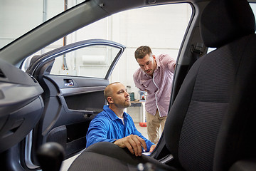 Image showing auto mechanic and man at car shop