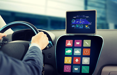 Image showing close up of man with gps on tablet pc driving car