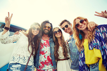 Image showing hippie friends over minivan car showing peace sign