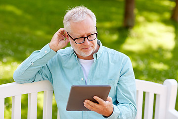 Image showing senior man with tablet pc at summer park