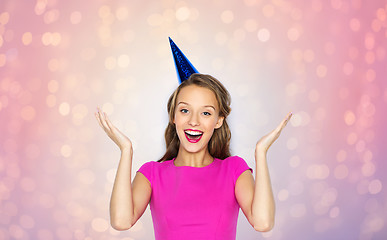 Image showing happy young woman or teen girl in party cap