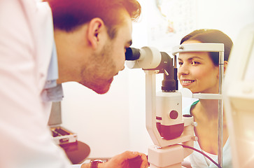 Image showing optician with tonometer and patient at eye clinic