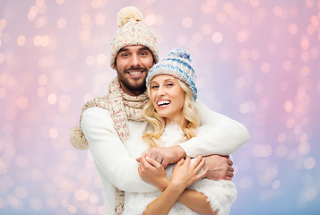 Image showing smiling couple in winter clothes hugging