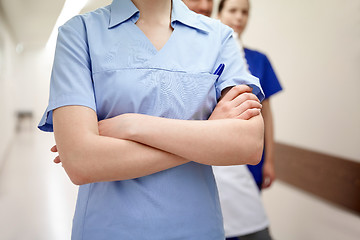 Image showing close up of medics or doctors at hospital corridor