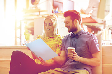 Image showing office workers with folder and coffee