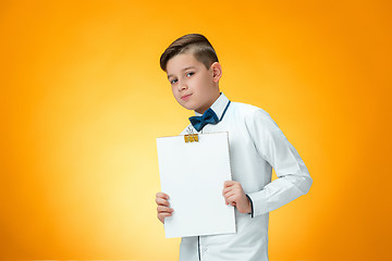 Image showing The boy with tablet for notes