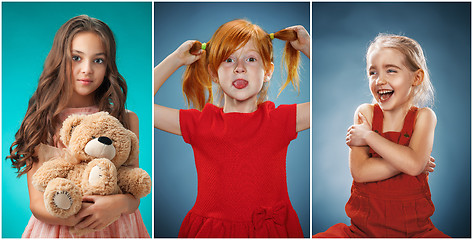 Image showing The cute cheerful little girls on blue background