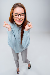 Image showing The smiling young business woman on gray background